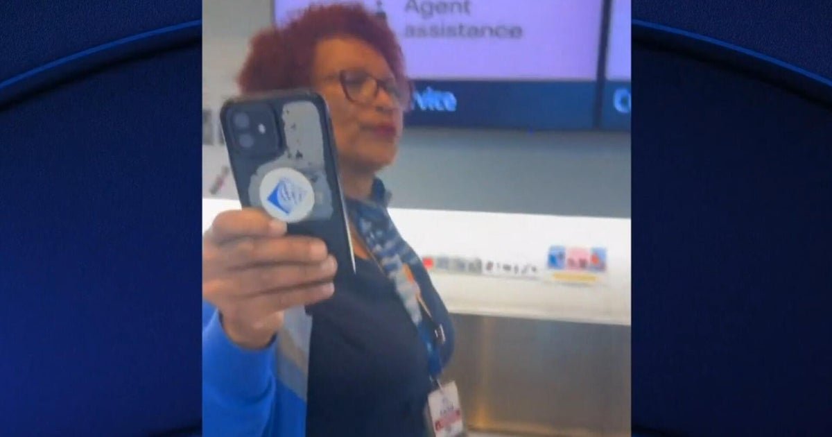 1784614328 cbsn fusion united airlines employee threatens to call ice on passenger video appears to show thumbnail