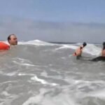 cbsn fusion lifeguards demonstrate how to escape from a rip current thumbnail