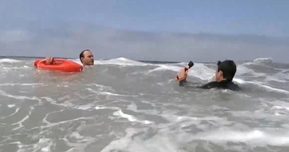 cbsn fusion lifeguards demonstrate how to escape from a rip current thumbnail