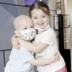 cbsn fusion touching video shows toddler twins hugging after one of them faced cancer treatment thumbnail