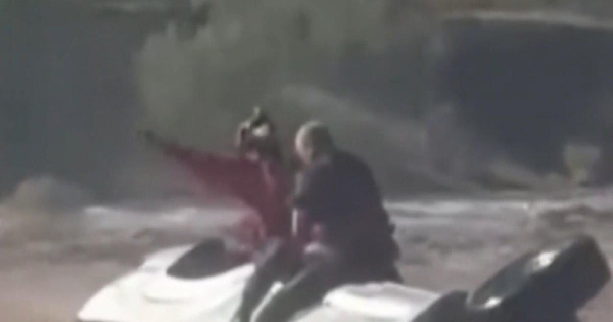 cbsn fusion video shows daring helicopter rescue after arizona mans truck gets stuck in floodwaters thumbnail