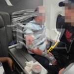 tmz american airlines passenger restrained